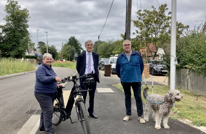 Cllr on bike, MP and Winnersh resident