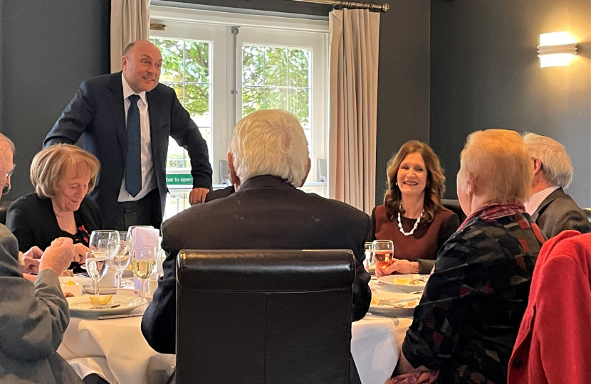 AG with guests at table